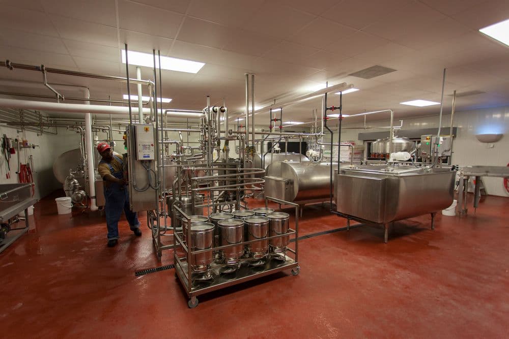 Stainless-steel tanks and equipment in a dairy plant.